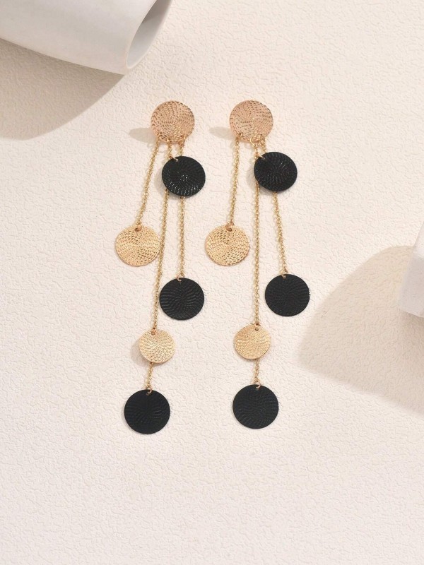 Kolczyki Black &amp; Gold Eclipse – długie złote kolczyki z czarnymi i złotymi krążkami, elegancka biżuteria o geometrycznym designie.
