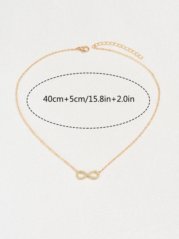 Złoty naszyjnik z zawieszką w kształcie nieskończoności ozdobioną drobnymi kryształkami (5).webp