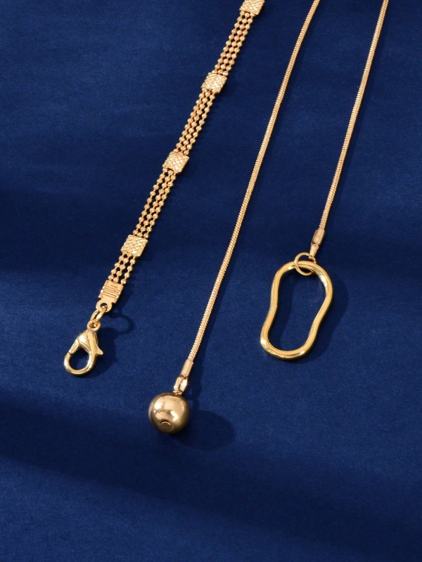 Złoty naszyjnik z podwójnym łańcuszkiem, geometryczną zawieszką i opadającym elementem zakończonym kulką (4).webp