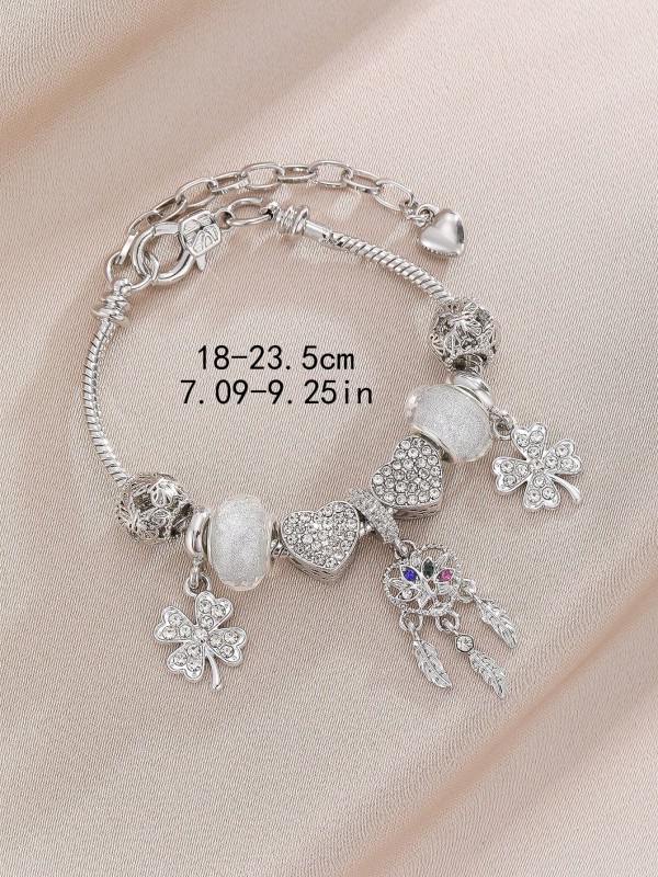 Srebrna bransoletka charms z sercami, koniczynką i zawieszką w stylu boho (4).webp