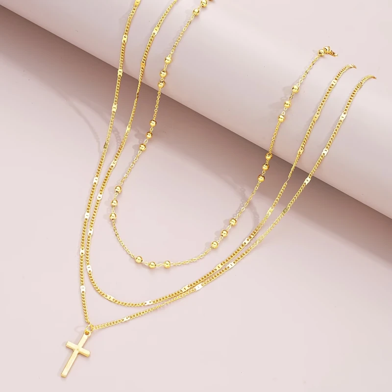 Naszyjnik Trinity Faith złoty potrójny warstwowy z krzyżykiem (2).webp