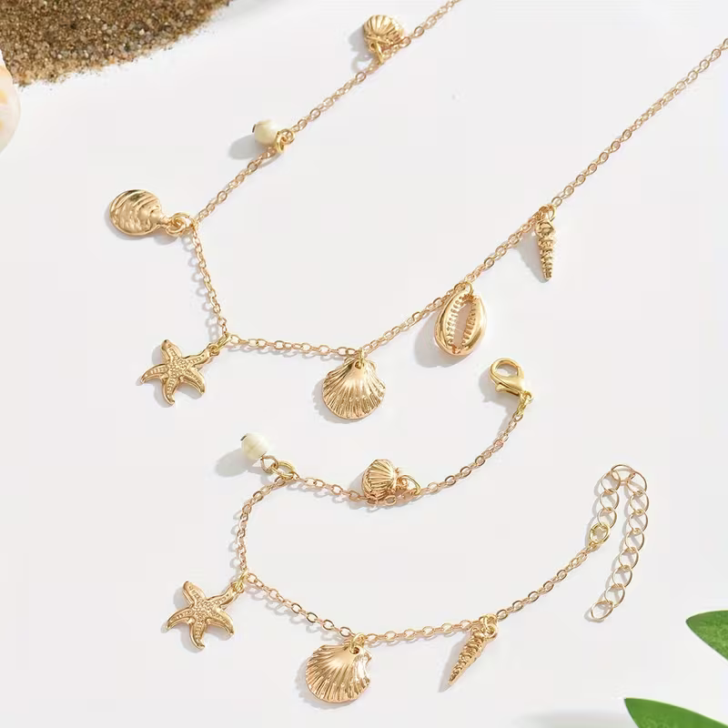 Zestaw Sea Charms Gold złoty naszyjnik i bransoletka z muszelkami i rozgwiazdami (5).webp