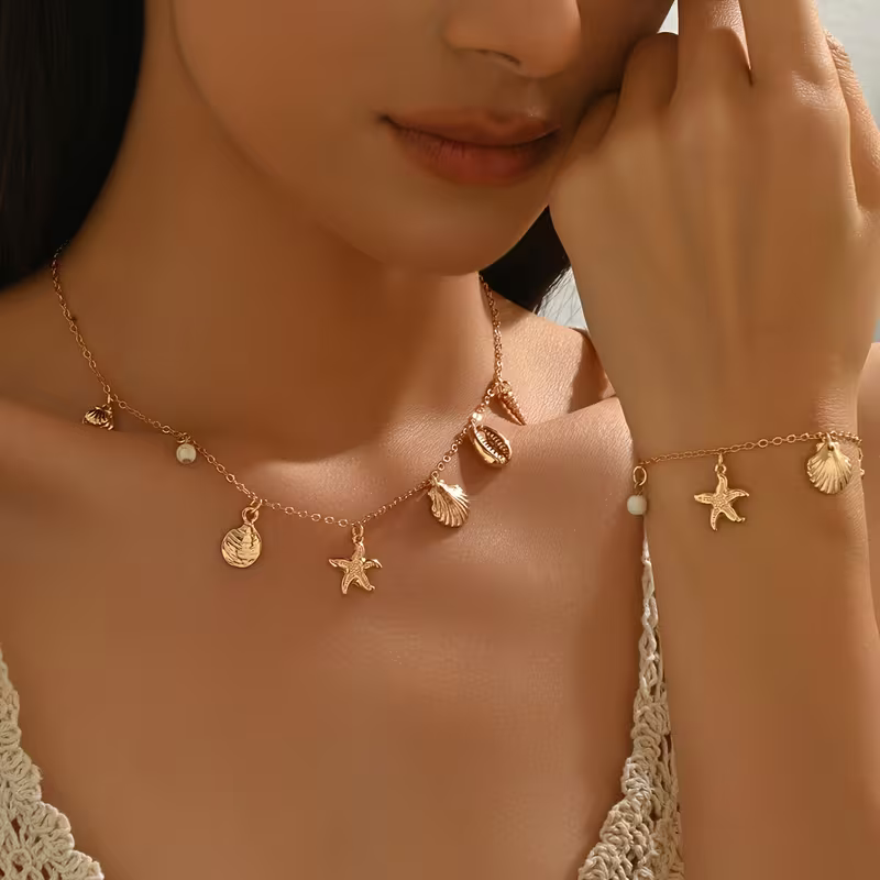 Zestaw Sea Charms Gold złoty naszyjnik i bransoletka z muszelkami i rozgwiazdami (3).webp