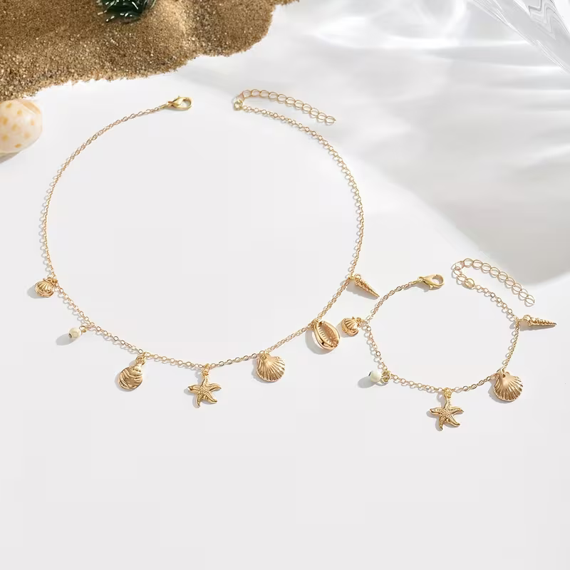 Zestaw Sea Charms Gold złoty naszyjnik i bransoletka z muszelkami i rozgwiazdami (2).webp